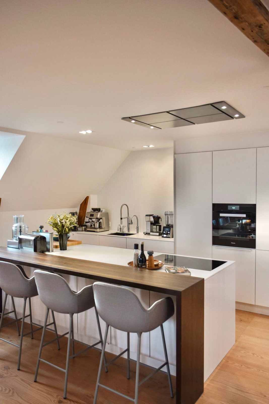 Kitchen with walnut island and bar seating